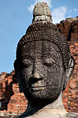 Ayutthaya, Thailand. Wat Mahathat, Buddha statue of the gallery enclosing the collapsed central prang.